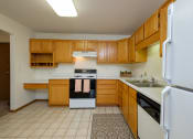 Thumbnail 9 of 15 - A kitchen with white appliances. Pinehurst Apartments | 2 Bedroom Plan