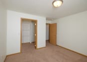 Thumbnail 14 of 15 - A bedroom with a walk  in closet. Pinehurst Apartments | 2 Bedroom Plan D | Bedroom