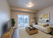 Thumbnail 3 of 26 - a living room with a couch and a coffee table. Fargo, ND Prairiewood Meadows Apartments