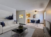 Thumbnail 1 of 26 - a living room with a couch and a coffee table in front of a dining room. Fargo, ND Prairiewood Meadows Apartments