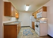 Thumbnail 7 of 21 - Prairiewood Courts Apartments | 2 Bdrm - Kitchen