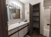 Thumbnail 15 of 25 - Grand Forks Primrose Apartments. A bathroom with a closet
