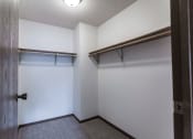Thumbnail 22 of 25 - Grand Forks Primrose Apartments. A small room with a white wall and a wooden door