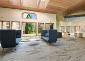 Thumbnail 25 of 30 - The Edge of Uptown Apartments | Atrium with comfortable chairs