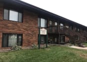 Thumbnail 10 of 10 - a building with a sign in front of it. Bismarck, ND Riverpark Apartments