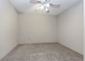 Thumbnail 13 of 41 - an empty room with white walls and a ceiling fan. Roseville, MN Rosedale Estates