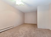 Thumbnail 21 of 41 - an empty room with carpet and a ceiling fan. Roseville, MN Rosedale Estates