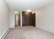 Thumbnail 20 of 41 - a bedroom with carpet and doors to a closet. Roseville, MN Rosedale Estates