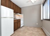 Thumbnail 24 of 41 - an empty kitchen with a refrigerator and a window. Roseville, MN Rosedale Estates