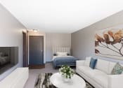 Thumbnail 7 of 41 - a living room with a couch and a coffee table and a bed. Roseville, MN Rosedale Apartments