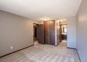 Thumbnail 31 of 41 - a bedroom with a closet and a bathroom