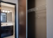 Thumbnail 32 of 41 - two views of a bathroom with a shower and a sink. Roseville, MN Rosedale Estates Apartments