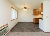 Thumbnail 10 of 34 - a dining room with a window and ceiling fan. Fargo, ND Islander Apartments