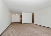 Thumbnail 9 of 13 - New Brighton, MN Sage Park Apartments a bedroom with a carpeted floor and white walls