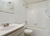Thumbnail 11 of 13 - a bathroom with a sink toilet and bathtub | Sage Park New Brighton, MN
