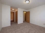 Thumbnail 6 of 19 - a master bedroom with a closet and bathroom attached. Fargo, ND South Pointe Apartments