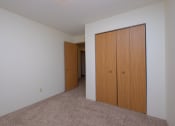 Thumbnail 10 of 19 - a bedroom with a closet. Fargo, ND South Pointe Apartments