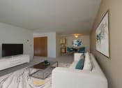 Thumbnail 2 of 19 - a living room with a couch and a coffee table. Fargo, ND South Pointe Apartments