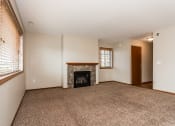 Thumbnail 8 of 19 - Grand Forks Sterling Pointe Apartments. A living room with a fireplace