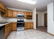 Thumbnail 11 of 43 - Stonebridge Apartments | 2 Bedroom Plan G | Kitchen | Dining