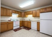 Thumbnail 18 of 43 - Stonebridge Apartments | 3 Bedroom Plan A | Kitchen | Dining