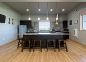 Thumbnail 15 of 16 - Community Kitchen at Stonefield Apartments in Bismarck, ND