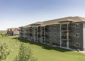 Thumbnail 1 of 16 - Exterior View at Stonefield Apartments in Bismarck, ND