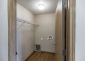 Thumbnail 16 of 20 - Empty room with a closet and a door to a bathroom at Sunset Ridge Apartments in Bismarck