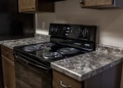 Thumbnail 10 of 27 - Grand Forks, ND Sunview Apartments. A close up of a black stove