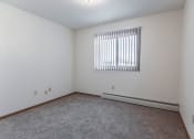 Thumbnail 16 of 27 - Grand Forks, ND Sunview apartments. a bedroom with white walls and a window