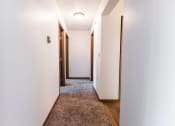 Thumbnail 23 of 27 - Grand Forks, ND Sunview apartments. a hallway with white walls and wooden floors