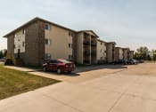 Thumbnail 26 of 27 - Grand Forks, ND Sunview apartments. Exterior of a three level apartment building with a parking lot out front