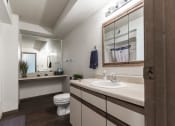 Thumbnail 24 of 27 - Grand Forks, ND Sunview apartments. a bathroom with a toilet sink and mirror