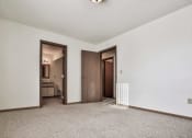 Thumbnail 19 of 27 - Grand Forks, ND Sunview apartments. a living room with white walls and a carpeted floor