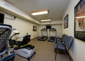 Thumbnail 20 of 21 - a fitness room with chairs. Fargo, ND Crossroads Apartments