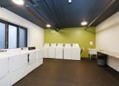 Thumbnail 23 of 30 - The Edge of Uptown Apartments | Laundry Facilities