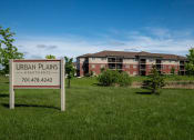 Thumbnail 44 of 45 - an urban plans sign in front of an apartment building
