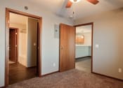 Thumbnail 29 of 45 - a bedroom and the bathroom. Fargo, ND Urban Plains Apartments