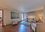 Thumbnail 8 of 45 - a living room with couches and chairs and a rug. Fargo, ND Urban Plains Apartments