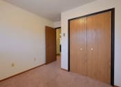 Thumbnail 15 of 26 - a bedroom with a closet. Fargo, ND Village West Apartments