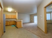 Thumbnail 26 of 61 - the kitchen and living room of an empty house
