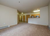 Thumbnail 25 of 61 - A spacious living room and kitchen of an empty apartment