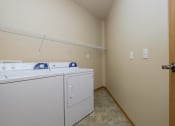 Thumbnail 29 of 61 - A washer and dryer in the laundry room of a home. West Fargo, ND West Lake Apartments.