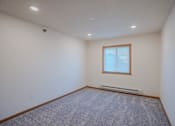 Thumbnail 37 of 49 - a bedroom with a window. Fargo, ND Lake Crest Apartments