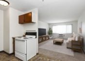 Thumbnail 3 of 9 - West St. Paul, MN Covington Courts Apartments | Living Room and Kitchen