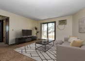Thumbnail 1 of 11 - White Bear Lake, MN White Bear Terrace Apartments. a living room with a couch and a coffee table
