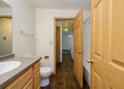 Thumbnail 9 of 9 - A bathroom with two doors. Fargo, ND Windgate Apartments.