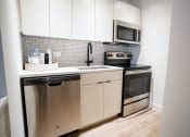 Thumbnail 12 of 30 - Modern Kitchen With White Cabinet at 21 E Chestnut, Chicago, 60611