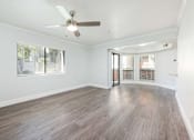 Thumbnail 17 of 36 - the living room of an empty house with a ceiling fan