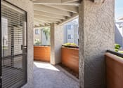 Thumbnail 19 of 36 - the entrance to a house with a courtyard and a door